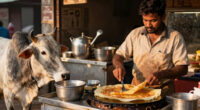 Dosa seller prepares Dosa for Cow that regularly visits his stall
